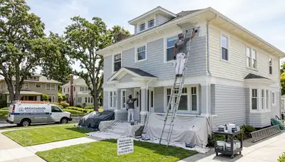 Professional house painters working on home exterior in San Francisco, CA